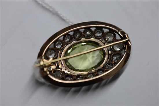 A Victorian gold and silver, pale green beryl and diamond set oval brooch, 36mm.